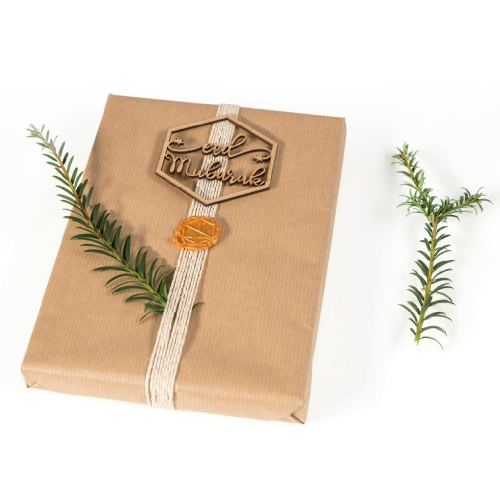 Using the Eid Mubarak Ornament on a boxed present