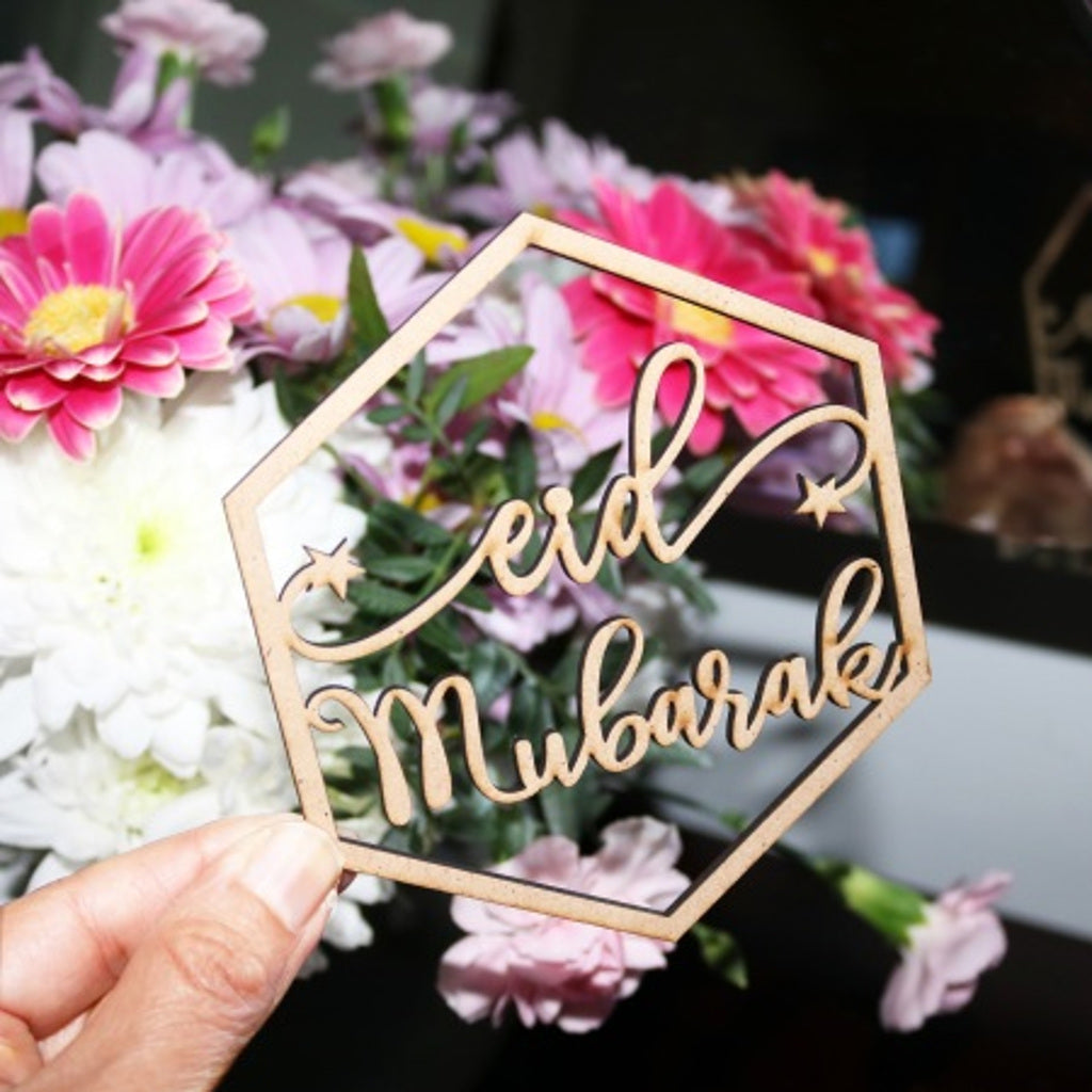 Someone holding the largest Eid Mubarak Ornament